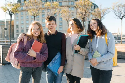 smiling-teens-ready-for-school-on-sunny-day-2026-03-16-05-12-18-utc.jpg
