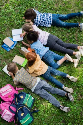 top-view-of-cute-little-kids-reading-books-while-l-2026-01-06-00-37-34-utc.jpg